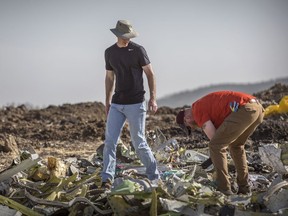 Foreign investigators examine wreckage at the scene where the Ethiopian Airlines Boeing 737 Max 8 crashed shortly after takeoff on Sunday killing all 157 on board, near Bishoftu, or Debre Zeit, south of Addis Ababa, in Ethiopia Tuesday, March 12, 2019.