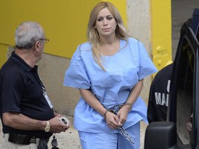 This Sept. 24, 2015 file photo shows Aurea Vazquez Rijos, who was accused more than a decade ago of the murder of her wealthy husband, Canadian Adam Anhang, in San Juan, Puerto Rico. (Carlos Giusti/El Vocero via AP File)