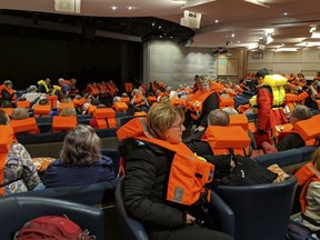 This photo provided by Michal Stewart shows passengers on board the Viking Sky, waiting to be evacuated, off the coast of Norway on Saturday, March 23, 2019.