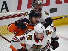 Edmonton Oilers Tobias Rieder and Chicago Blackhawks Connor Murphy battle in front of goalie Cam Ward during NHL action at Rogers Place in Edmonton on Tuesday, Feb. 5, 2019.