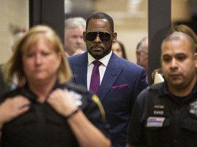 R. Kelly walks out of The Daley Center after an appearance in court for his child support case in Chicago, Wednesday, March 13, 2019.
