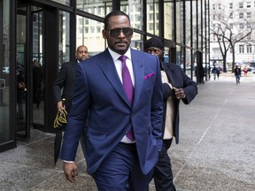 R. Kelly walks out of The Daley Center after an appearance in court for his child support case, March 13, 2019, in Chicago.