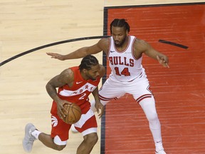 Raptors Kawhi Leonard drives to the net past Chicago Bulls' Wayne Selden during the second quarter on Tueday night. Jack Boland/Toronto Sun/Postmedia Network