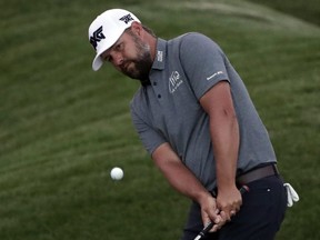 Ryan Moore chips onto the ninth green during the first round of The Players Championship in Ponte Vedra Beach, Fla., on Thursday, March 14, 2019.