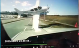 A plane narrowly misses a vehicle on 16th Ave. in Markham next to Buttonville airport on March 12, 2019. (Screengrab)