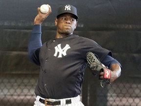 In this Feb. 14, 2019, file photo, New York Yankees starting pitcher Luis Severino throws in the bullpen at the Yankees spring training baseball facility, in Tampa, Fla. (AP Photo/Lynne Sladky, File)
