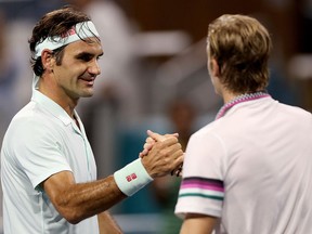 Roger Federer of Switzerland is congratulated by Denis Shapovalov of Canada after their match at the Miami Open at Hard Rock Stadium March 29, 2019 in Miami Gardens, Florida.(Matthew Stockman/Getty Images)