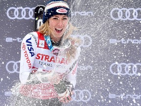 United States' Mikaela Shiffrin celebrates on the podium after winning an Alpine Skiing World Cup women's Slalom, in Spindleruv Mlyn, Czech Republic, Saturday, March. 9, 2019.