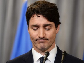 Prime Minister Justin Trudeau pauses after delivering an official apology to Inuit for the federal government's management of tuberculosis in the Arctic from the 1940s to the 1960s during an event in Iqaluit, Nunavut on Friday, March 8, 2019.