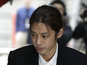 K-pop singer Jung Joon-young arrives to attend a hearing at the Seoul Central District Court in Seoul, South Korea, Thursday, March 21, 2019.