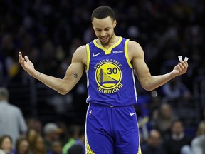 Golden State Warriors' Stephen Curry reacts after a foul was called against him during NBA play against the Philadelphia 76ers, Saturday, March 2, 2019, in Philadelphia. (AP Photo/Matt Slocum)