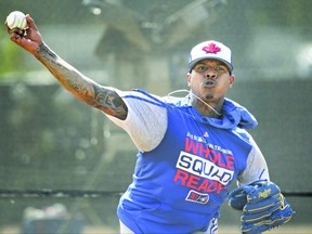 Toronto Blue Jays pitcher Marcus Stroman throws a bullpen session during baseball spring training in Dunedin, Fla.