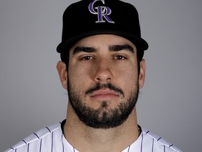 In this Feb. 20, 2019, file photo, Colorado Rockies' Mike Tauchman poses for a photo in Scottsdale, Ariz. (AP Photo/Chris Carlson, File)