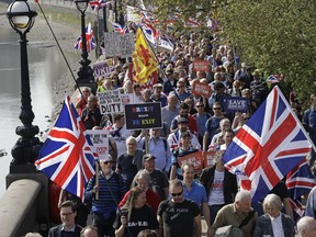 Pro-Brexit supporters take part in the final leg of the "March to Leave" along the embankment in London, Friday, March 29, 2019.