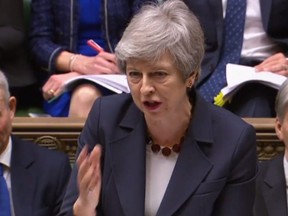 A video grab from footage broadcast by the UK Parliament's Parliamentary Recording Unit (PRU) shows Britain's Prime Minister Theresa May speaking during the weekly Prime Minister's Questions (PMQs) question and answer session in the House of Commons in London on Wednesday, March 27, 2019.