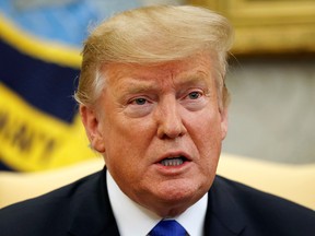 In this March 6, 2019, photo, President Donald Trump speaks in the Oval Office of the White House in Washington.