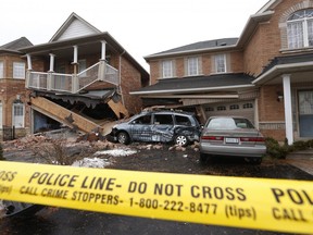 Homes and vehicles severely damaged in Scarborough on Grackle Trail after an early morning TTC bus crash Thursday March 21, 2019. Jack Boland/Toronto Sun