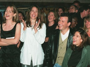 In this Nov. 11, 1996, file photo, "Mad About You" cast members Helen Hunt, from left, Anne Ramsay, Paul Reiser and Reiser's wife Paula laugh at a satiric video made by the show's crew during a private party at the House of Blues in West Hollywood, Calif., to celebrate the NBC television comedy's first 100 episodes.