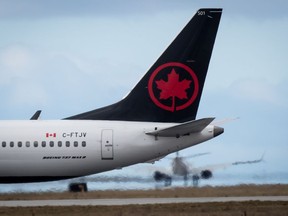 An Air Canada Boeing 737 Max 8 aircraft departing for Calgary taxis to a runway at Vancouver International Airport in Richmond, B.C., on Tuesday, March 12, 2019.