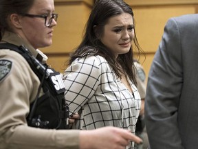 Tay'Lor Smith fights back tears as she is escorted out of the courtroom in handcuffs after being sentenced at the Clark County Courthouse in Vancouver, Wash., on Wednesday, March 27, 2019. Smith pleaded guilty to pushing Jordan Holgerson off the bridge at Moulton Falls Regional Park in August. She was sentenced to two days in jail and 38 days on a county work crew.