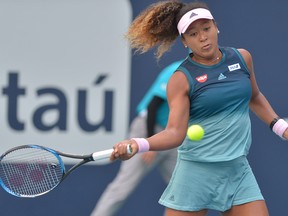 Naomi Osaka, of Japan, returns to Hsieh Su-wei, of Taiwan, during the Miami Open tennis tournament, Saturday, March 23, 2019, in Miami Gardens, Fla. (Johnny Louis/WENN.com)