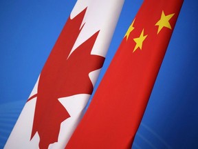 Flags of Canada and China are placed for the first China-Canada economic and financial strategy dialogue in Beijing, China, Monday, Nov. 12, 2018.