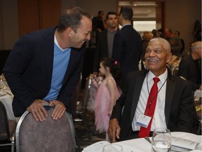 Former Expos manager Felipe Alou and businessman Mitch Garber, who is part of a team trying to bring Major League Baseball back to Montreal, enjoy the 15th Annual Sports Celebrity Breakfast on Sunday at the Cummings Jewish Centre.