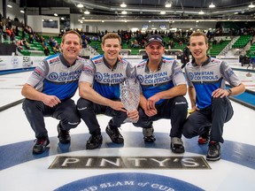 Skip Brendan Bottcher, right, celebrates his win with teammates Karrick Martin, left, Bradley Thiessen, centre left, and Darren Moulding at the men's final of the Humpty's Champions Cup against Team Koe in Saskatoon, on Sunday April 28, 2019. (THE CANADIAN PRESS/Matt Smith)