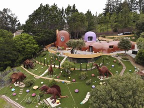 This Monday, April 1, 2019 photo, shows an aerial view of the Flintstone House in Hillsborough, Calif.. (AP Photo/Terry Chea)