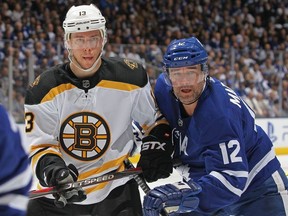 Charlie Coyle of the Boston Bruins skates against Patrick Marleau of the Toronto Maple Leafs in Game Six of the Eastern Conference First Round during the 2019 NHL Stanley Cup Playoffs at Scotiabank Arena on April 21, 2019 in Toronto, Ontario, Canada. The Bruins defeated the Maple Leafs 4-2.