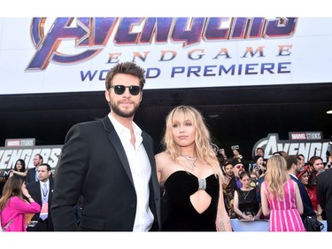 (L-R) Liam Hemsworth and Miley Cyrus attend theworld premiere of Marvel Studios' "Avengers: Endgame" at the Los Angeles Convention Center on April 22, 2019 in Los Angeles.