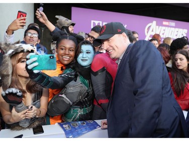President of Marvel Studios/producer Kevin Feige takes a selfie with fans during the world premiere of Marvel Studios' "Avengers: Endgame" at the Los Angeles Convention Center on April 22, 2019 in Los Angeles.