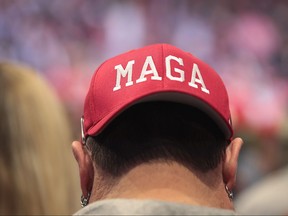 Guests listen as President Donald Trump speaks during a rally at the Van Andel Arena on March 28, 2019 in Grand Rapids, Michigan.