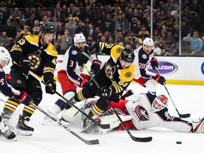 Bruins’ Brad Marchand dives as he shoots against the Blue Jackets in Game 1. The Bruins won the game overtime.  Getty Images