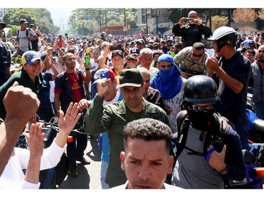 Supporters of Juan Guaido march near the air force base La Carlota on April 30, 2019 in Caracas, Venezuela.
