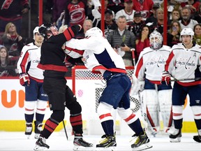Washington Capitals Alex Ovechkin, right, knocks out Andrei Svechnikov of the Carolina Hurricanes as they fight during the first period in Game Three of the Eastern Conference First Round during the 2019 NHL Stanley Cup Playoffs at PNC Arena on April 15, 2019 in Raleigh, N.C. (Grant Halverson/Getty Images)