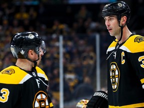 Boston Bruins' Brad Marchand (left) talks to Zdeno Chara during Thursday's Game 1 loss to Toronto. (GETTY IMAGES)