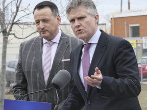 Environment Minister Rob Phillips and Energy Minister Greg Rickford held an April 8 press conference in Oakville to unveil plans to put anti-carbon tax stickers on gas pumps. (Veronica Henri, Toronto Sun)