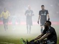 Toronto FC forward Jozy Altidore recovers on the ground after being tackled during last week's game against Minnesota. (THE CANADIAN PRESS)