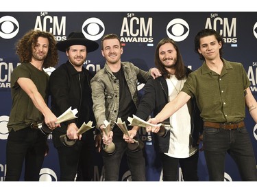 Eric Steedly, from left, Jared Hampton, Brandon Lancaster, Tripp Howell and Chandler Baldwin, of Lanco, pose in the press room with the award for new duo or group of the year at the 54th annual Academy of Country Music Awards at the MGM Grand Garden Arena on Sunday, April 7, 2019, in Las Vegas.