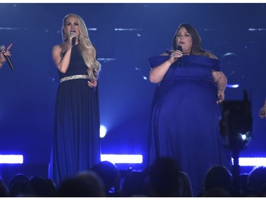Carrie Underwood, left, and Chrissy Metz perform "I'm Standing with You" at the 54th annual Academy of Country Music Awards at the MGM Grand Garden Arena on Sunday, April 7, 2019, in Las Vegas.