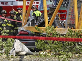 A construction crane working on a building collapsed near the intersection of Mercer Street and Fairview Avenue near Interstate 5, Saturday, April 27, 2019, in downtown Seattle. (Genna Martin/seattlepi.com via AP)
