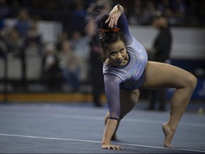 In this Feb. 1, 2019, file photo, Auburn's Samantha Cerio performs a floor routine during an NCAA gymnastics meet against Kentucky,in Lexington, Ky.