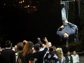 Illusionist David Blaine hangs upside down at Wollman Rink in Central Park on September 22, 2008 in New York City.