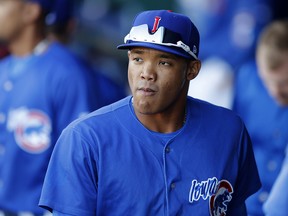 Iowa Cubs shortstop Addison Russell walks in the dugout before a triple-A game against the Nashville Sounds, Wednesday, April 24, 2019, in Des Moines, Iowa. (AP Photo/Charlie Neibergall)