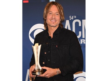 Australian singer Keith Urban poses with the award for Entertainer of the Year in the press room during the 54th Academy of Country Music Awards on April 7, 2019, at the MGM Grand Garden Arena in Las Vegas.