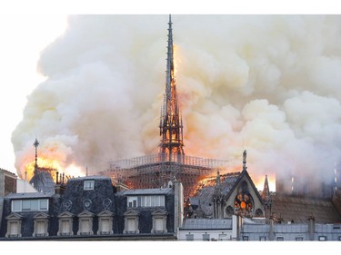 Smoke and flames rise during a fire at the landmark Notre Dame Cathedral in central Paris on April 15, 2019, potentially involving renovation works being carried out at the site, the fire service said.