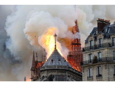 Smoke and flames rise during a fire at the landmark Notre-Dame Cathedral in central Paris on April 15, 2019, potentially involving renovation works being carried out at the site, the fire service said.