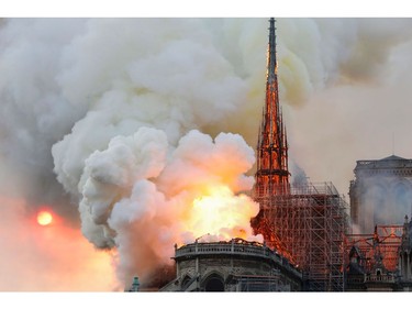 Smoke and flames rise during a fire at the landmark Notre Dame Cathedral in central Paris on April 15, 2019, potentially involving renovation works being carried out at the site, the fire service said.