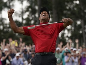 Tiger Woods reacts as he wins the Masters golf tournament Sunday, April 14, 2019, in Augusta, Ga.